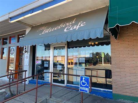 Exterior view of The Bluebird Cafe, a cozy venue nestled in Nashville, known for its intimate atmosphere and live music performances.