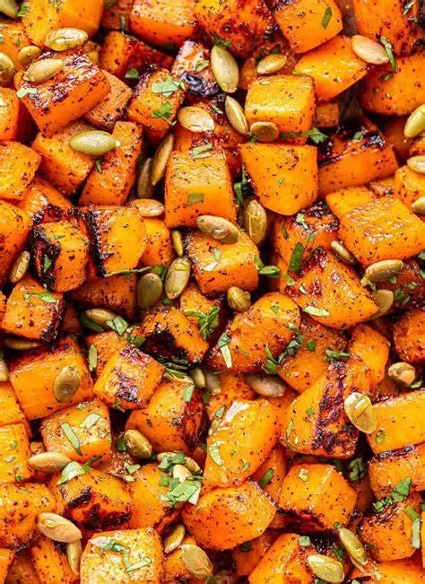 Roasted chunks of butternut squash with crispy edges.